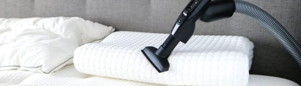 Vacuum the new pillow to remove smell